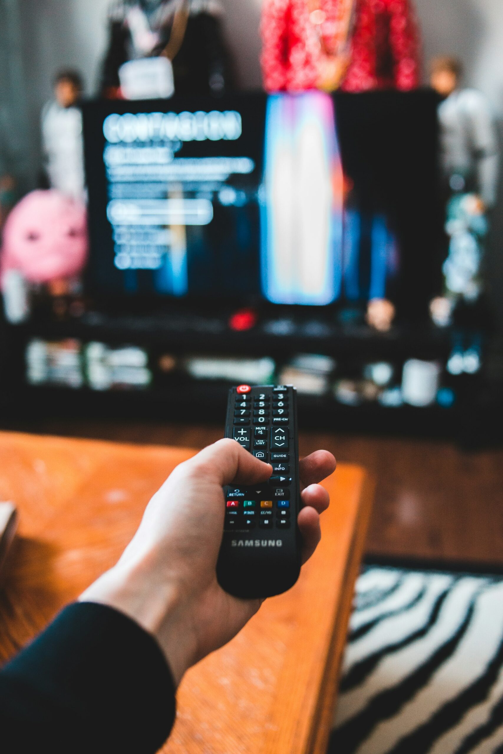 Remote control pointed at a TV